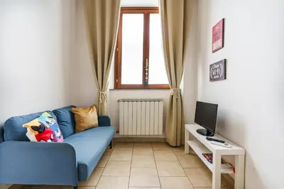 Area soggiorno di Pisana Apartment By San Firenze Collection