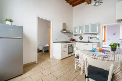 Cucina o angolo cottura di Pisana Apartment By San Firenze Collection