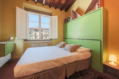 Letto o letti in una camera di Apartments Florence- Window on the Cathedral
