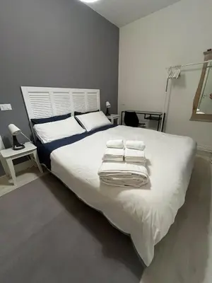 Letto o letti in una camera di Facibeni Room with Private Living & Parking