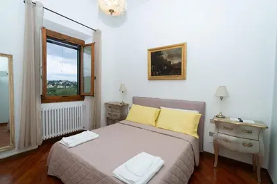 Letto o letti in una camera di Villa Morandi