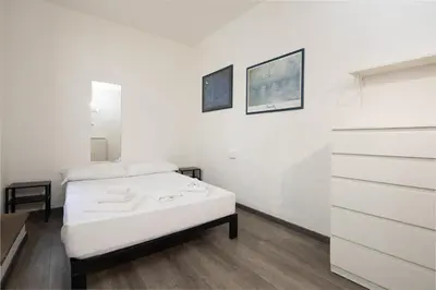 Letto o letti in una camera di Santo Spirito Urban Apartment