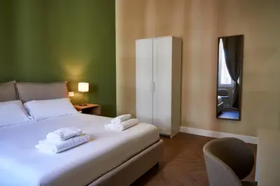 Letto o letti in una camera di BNB The Nymph and Africo Beccaria