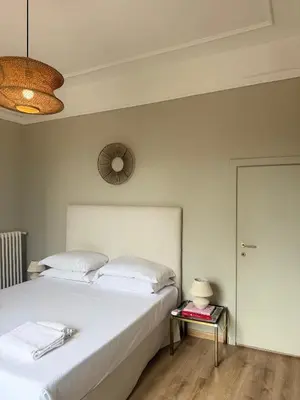 Letto o letti in una camera di Bohèmian View Santa Maria Novella