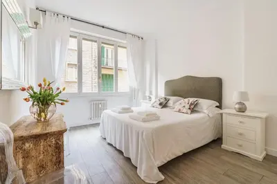 Letto o letti in una camera di Lilla Suite - Florence Dolce Vita