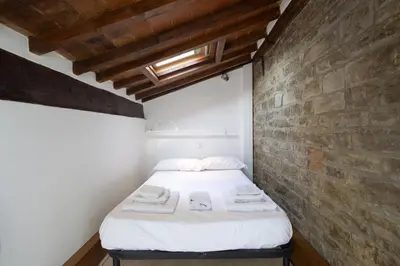 Letto o letti in una camera di Tuscan Top Floor Duplex