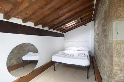 Letto o letti in una camera di Tuscan Top Floor Duplex