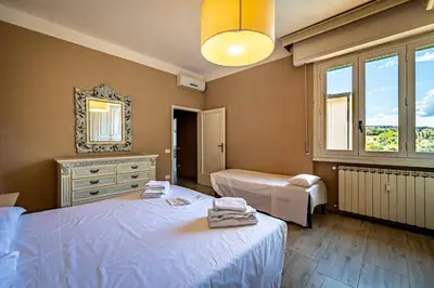 Letto o letti in una camera di YD penthouse Torregalli