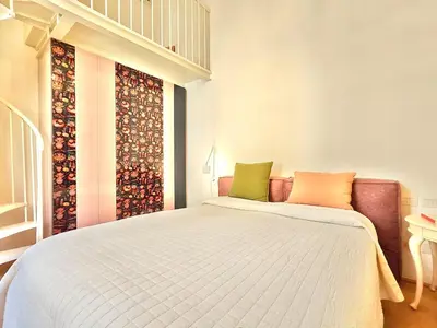 Letto o letti in una camera di Chic Mamma Magnifico Suite