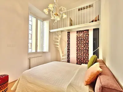 Letto o letti in una camera di Chic Mamma Magnifico Suite