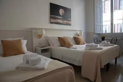 Letto o letti in una camera di Hotel Canada