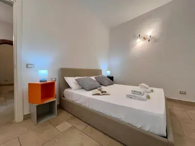 Letto o letti in una camera di San Frediano Novilia Apartment