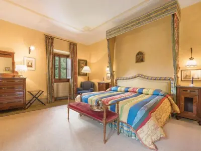 Letto o letti in una camera di Villa il Poggiolo
