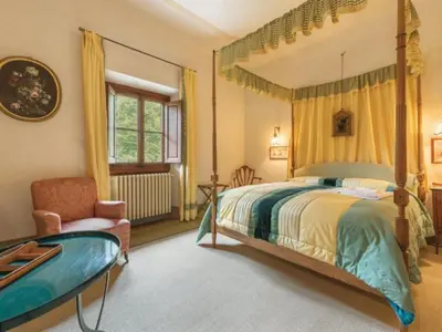 Letto o letti in una camera di Villa il Poggiolo