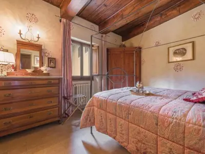 Letto o letti in una camera di Villa il Poggiolo