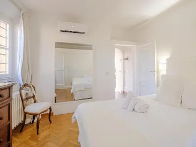 Letto o letti in una camera di Lucia Penthouse - Magic Views in a Medici Palace