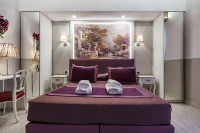 Letto o letti in una camera di Michelangelo King Deluxe Suite