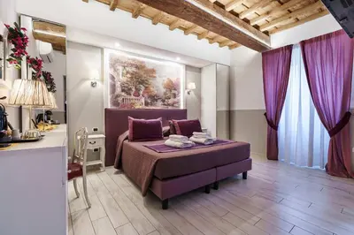 Letto o letti in una camera di Michelangelo King Deluxe Suite