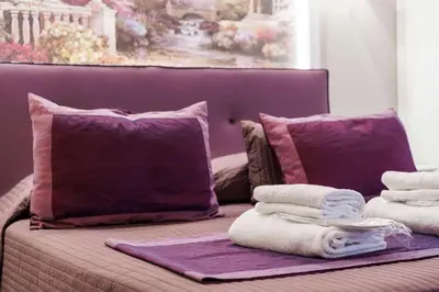 Letto o letti in una camera di Michelangelo King Deluxe Suite