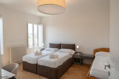 Letto o letti in una camera di Duomo Giglio Viola