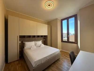Letto o letti in una camera di Comfort Flat - Careggi Firenze