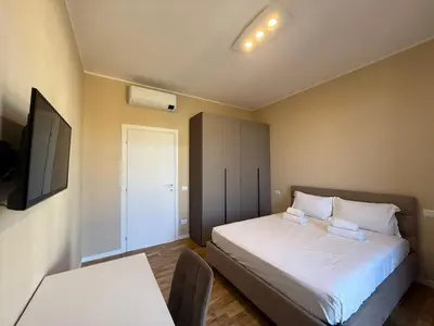 Letto o letti in una camera di Comfort Flat - Careggi Firenze
