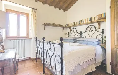 Letto o letti in una camera di La Casetta