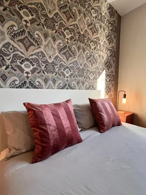 Letto o letti in una camera di Secret Garden Florence - Modern Apart ment near Center
