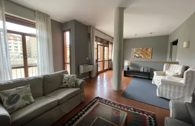 Area soggiorno di Old Bridge Florence Apartment