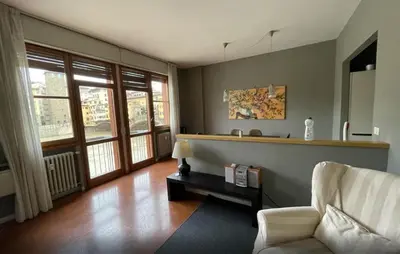 Area soggiorno di Old Bridge Florence Apartment