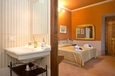 Letto o letti in una camera di Villa D'Arte Agri Resort