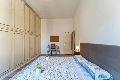 Letto o letti in una camera di UNYCA - Spacious Florence 3-bedroom Apartment