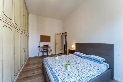 Letto o letti in una camera di UNYCA - Spacious Florence 3-bedroom Apartment