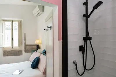 Letto o letti in una camera di Artsy Loft