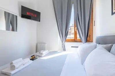 Letto o letti in una camera di Porta Romana-Boboli -Florentine Charm Free-Wifi