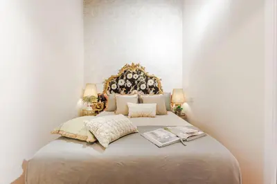 Letto o letti in una camera di The Boboli Retreat Firenze