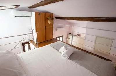 Letto o letti in una camera di Acacia Firenze - Loto