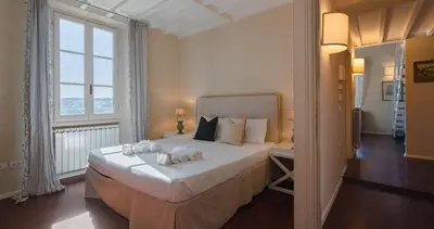 Letto o letti in una camera di Firenze 15 Min Esclusiva Residenza Storica