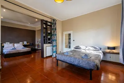Letto o letti in una camera di Loft Fortezza da Basso -10 minutes from SMN Train Station-