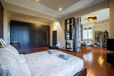 Letto o letti in una camera di Loft Fortezza da Basso -10 minutes from SMN Train Station-
