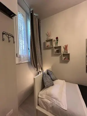 Letto o letti in una camera di Solo nel Cuore di Firenze