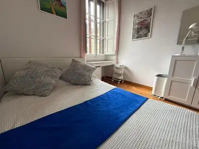 Letto o letti in una camera di Stylish 3-Bedroom Apartment in Prestigious Florence