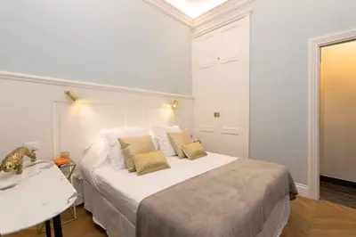 Letto o letti in una camera di BLUE SUITE - Pitti Place Residence