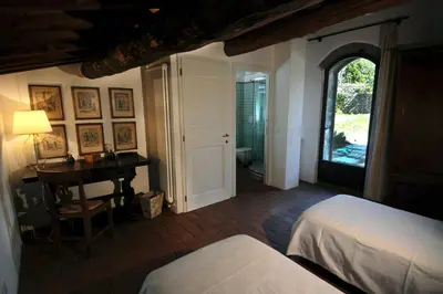 Letto o letti in una camera di Fattoria il Leccio - Camera doppia con letti singoli