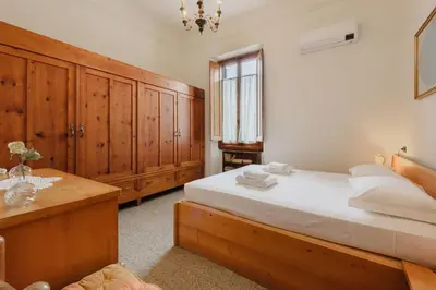 Letto o letti in una camera di La Margherita by MMega