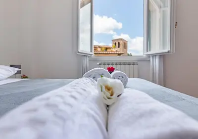 Letto o letti in una camera di brd 41 13- Ponte Vecchio Elegant Central Attic