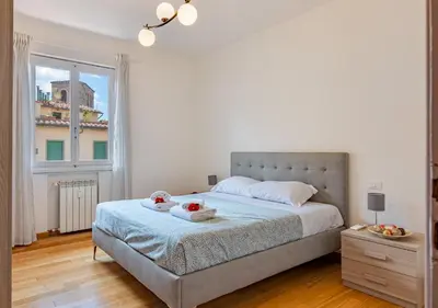 Letto o letti in una camera di brd 41 12- Ponte Vecchio Spacious Central Penthouse