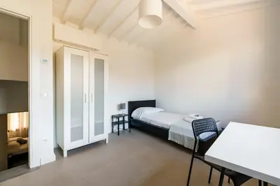 Letto o letti in una camera di Ghibellina Suites By San Firenze Collection