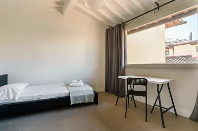 Letto o letti in una camera di Ghibellina Suites By San Firenze Collection