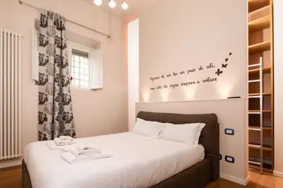 Letto o letti in una camera di Florence Cozy Duplex